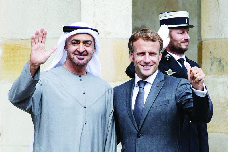 FONTAINEBLEAU, France: French President Emmanuel Macron poses with Abu Dhabi Crown Prince Mohammed bin Zayed upon their arrival at the Fontainebleau castle in Fontainebleau yesterday ahead of their working lunch. – AFP n