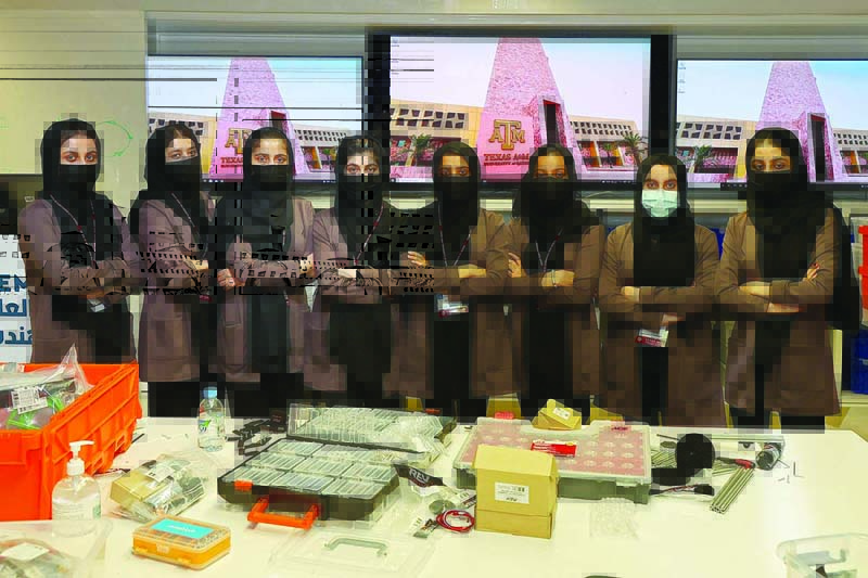DOHA: Members of an all-girl Afghan robotics team pose for a picture at the laboratory of Qatar's Texas A&M university on Sept 14, 2021. - AFP n