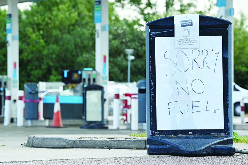 TONBRIDGE, United Kingdom: A sign informs motorists that there is no fuel at a petrol station in southeast England yesterday. - AFP n