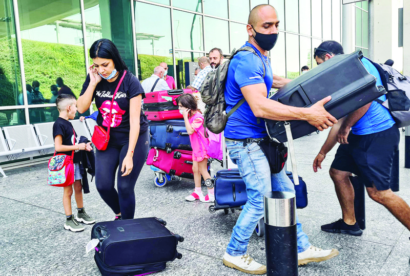 LARNACA: Members of the Abi Haidar family arrive at Larnaca International Airport on Sept 2, 2021. - AFP n