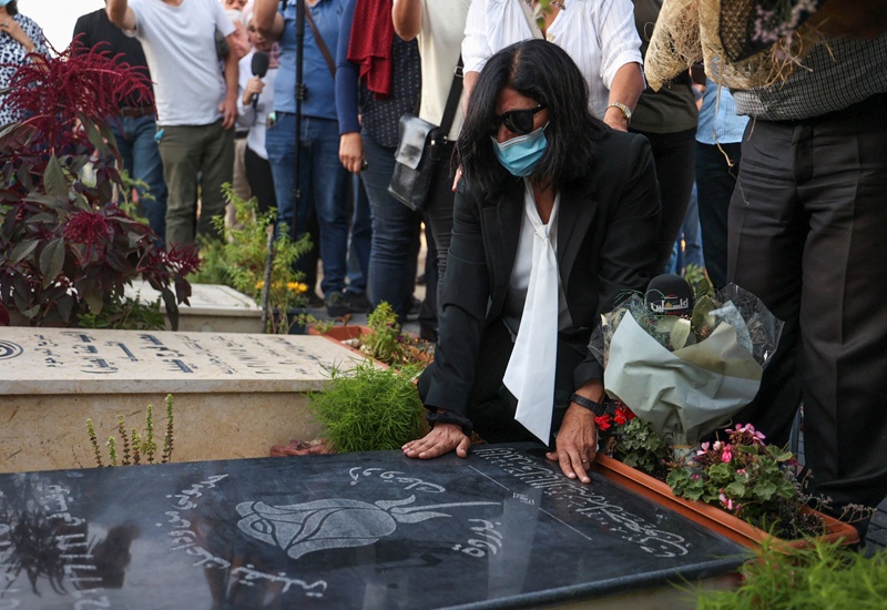 RAMALLAH: Palestinian lawmaker Khalida Jarrar visits the grave of her daughter at the Ramallah city cemetery in the occupied West Bank on Sunday following her release from a Zionist prison. - AFP n