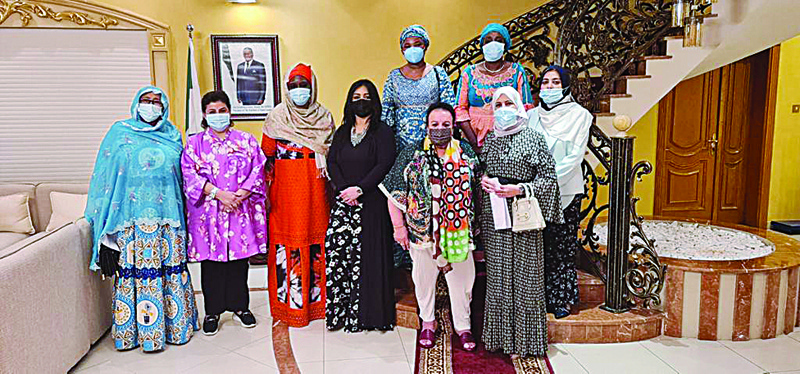 KUWAIT: Members of the Diplomatic Women's Committee pose for a group photo during their meeting.n