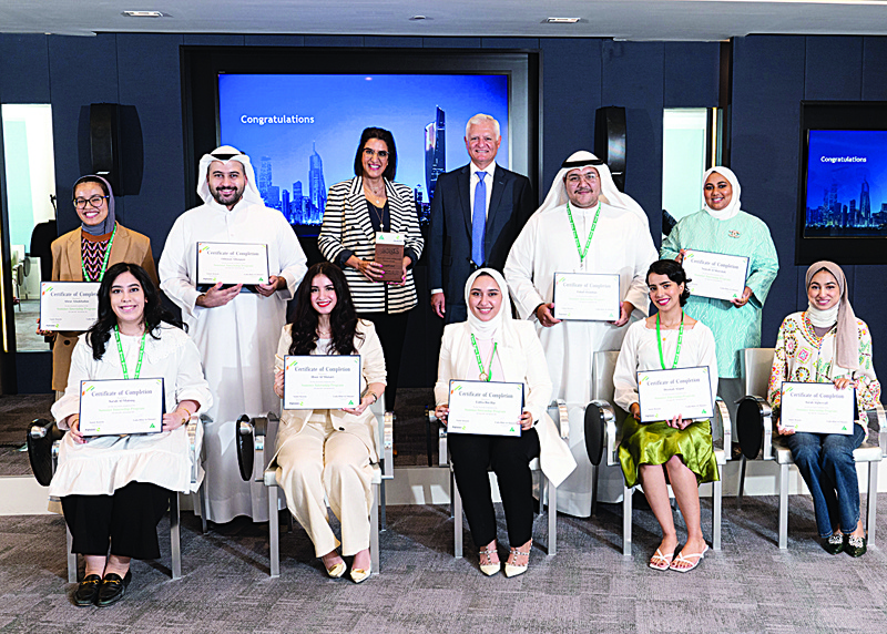 KUWAIT: CEO of Alghanim Industries Samir Kasem and CEO of INJAZ-Kuwait Laila Hilal Al-Mutairi in a group photo with a number of trainees.n
