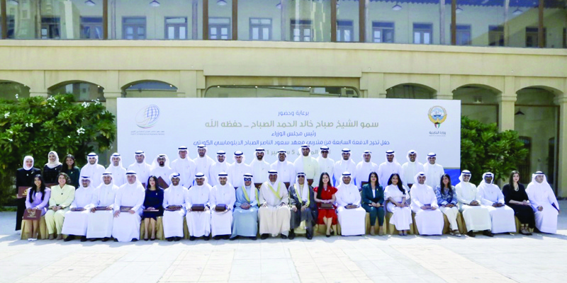 KUWAIT: Kuwait's Prime Minister His Highness Sheikh Sabah Al-Khaled Al-Hamad Al-Sabah is seen in a group picture with the Saud Al-Nasser Al-Sabah Diplomatic Institute's seventh class of graduates. - KUNA photosn