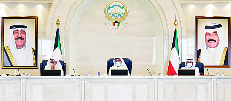 KUWAIT: Acting Prime Minister and Defense Minister Sheikh Hamad Jaber Al-Ali Al-Sabah (center) chairs the Cabinet's meeting yesterday. - KUNAn