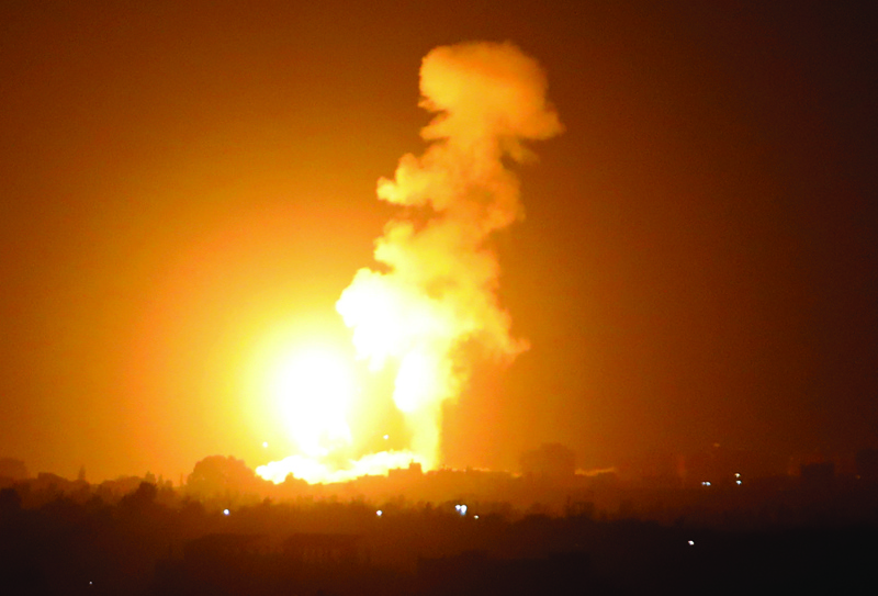 KHAN YUNIS: A fireball rises following an air strike in Khan Yunis in the southern Gaza Strip, late on September 6, 2021. - AFP n