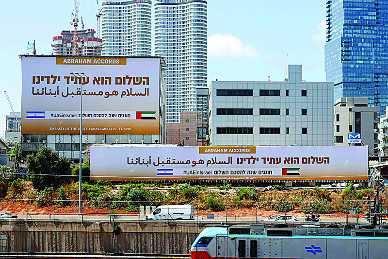 TEL AVIV: Billboards by the United Arab Emirates Embassy marking the signing of the US-brokered Abraham Accords are seen along the expressway in the coastal city of Tel Aviv yesterday. - AFP n