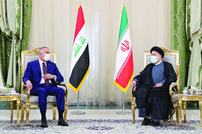 TEHRAN: Iran's recently-elected president Ebrahim Raisi meets with Iraqi Prime Minister Mustafa Al-Kadhemi (left) in the capital Tehran. - AFP n