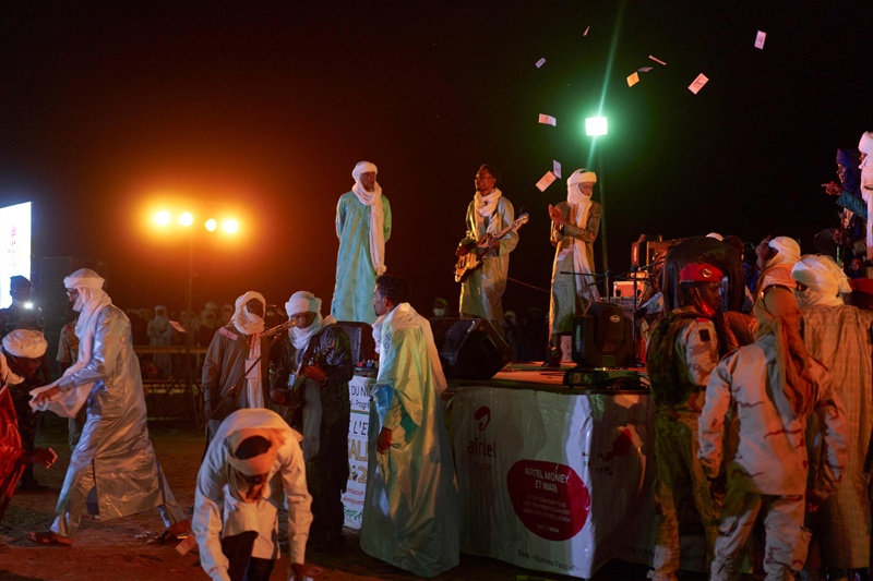 A group of Tuareg musicians is seen playing in a concert at the Cure Salee, in Ingall. - AFPnn