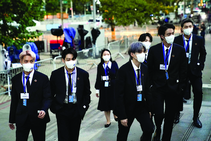 Members of the South Korean boy band BTS wear facemasks before they take turns speaking at the SDG Moment event as part of the UN General Assembly 76th session General Debate at United Nations Headquarters, in New York.—AFP photosn