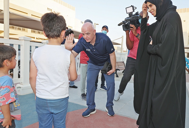 DOHA: Qatar's assistant Foreign Minister Lolwah Al-Khater and FIFA President Gianni Infantino visit the Park View Villas, a Qatar's 2022 FIFA World Cup residence in Doha housing Afghan refugees, on September 4, 2021. -- AFP