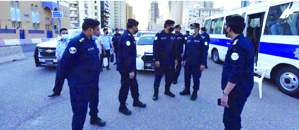KUWAIT: This handout photo released by the Interior Ministry yesterday shows policeman during a crackdown in Bneid Al-Qar.n