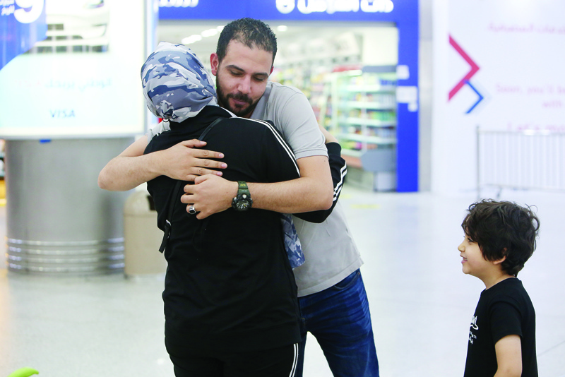 KUWAIT: Travelers are greeted warmly upon their arrival to Kuwait yesterday, coming from Egypt on direct flights for the first time since the Cabinet's decision to allow direct flights between the two countries. - Photos by Yasser Al-Zayyat