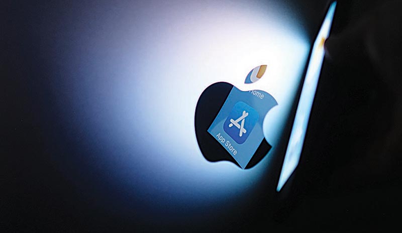 This file illustration photo shows the Apple app store logo reflected from an iPhone onto the back of an iMac in Los Angeles.-AFP