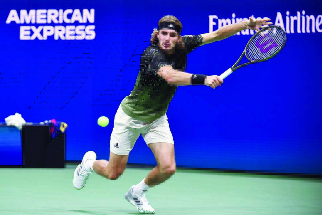 NEW YORK: Greece’s Stefanos Tsitsipas hits a return to France’s Adrian Mannarino during their 2021 US Open Tennis tournament men’s singles second round match at the USTA Billie Jean King National Tennis Center in New York, on Wednesday. —AFP