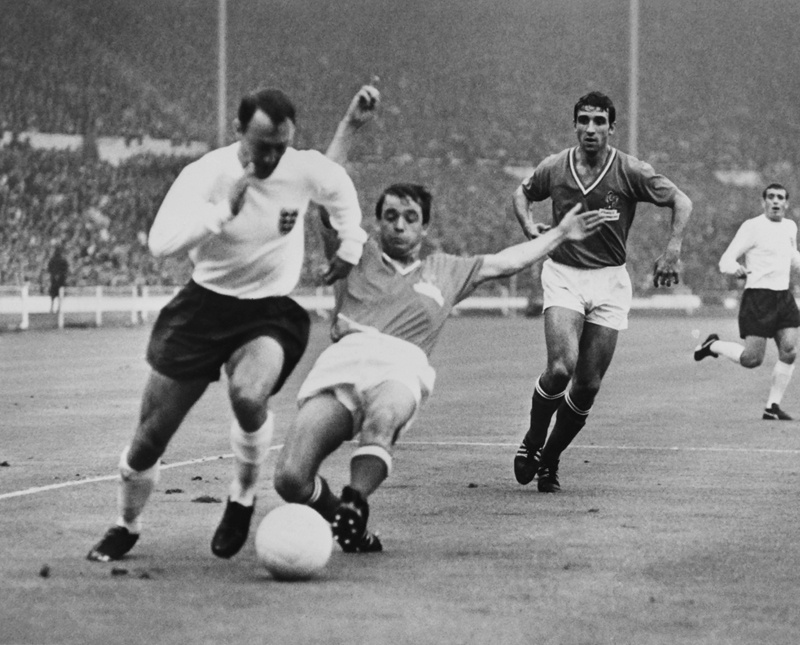 LONDON: In this file photo taken on July 20, 1966, England international football player Jimmy Greaves (left) fights with French footballer Jacky Simon, during the match between France and England of the football World Cup, at the Wembley stadium. - AFPn