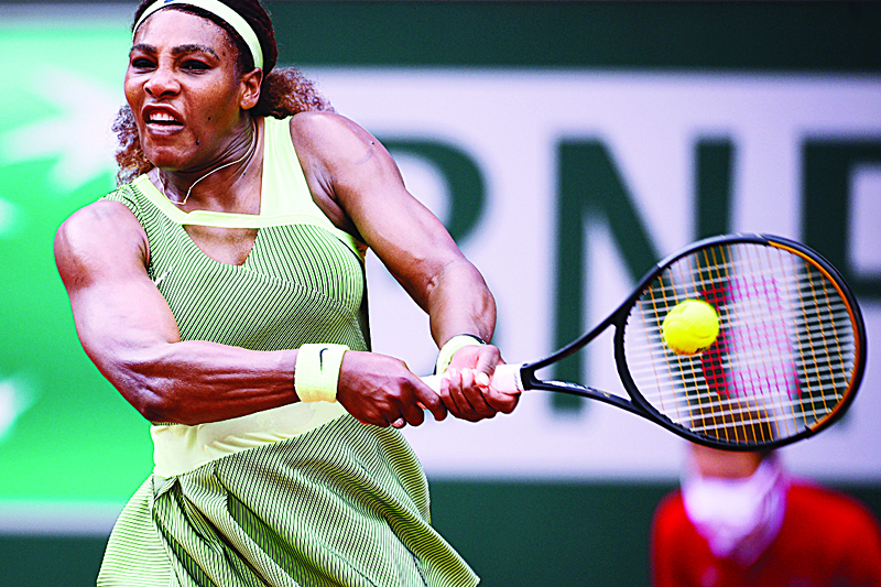 PARIS: In this file photo taken on June 4, 2021, Serena Williams of the US returns the ball to Danielle Collins of the US during their women's singles third round tennis match on Day 6 of The Roland Garros 2021 French Open tennis tournament in Paris. - AFPn
