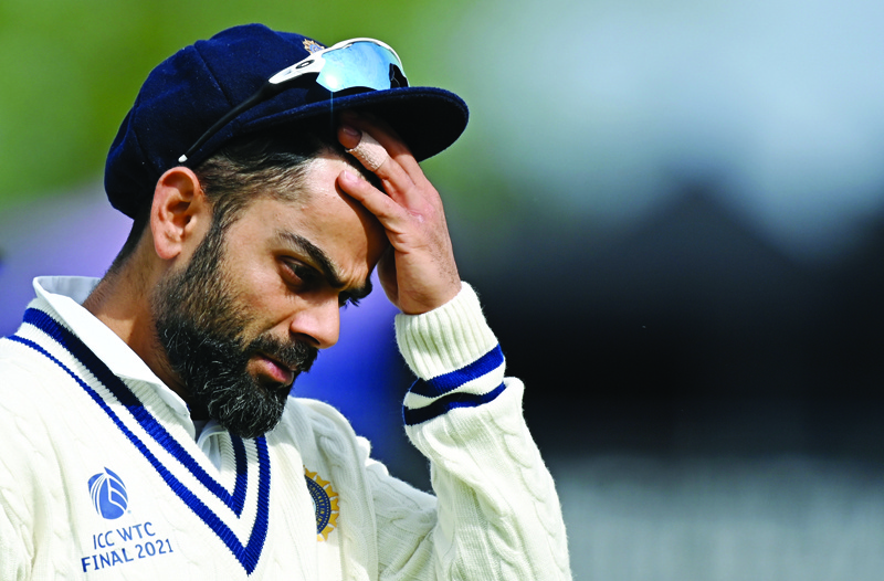 SOUTHAMPTON: In this file photo taken on June 22, 2021, India's Virat Kohli reacts as he walks back to the pavilion at the end of New Zealand's innings on the fifth day of the ICC World Test Championship Final between New Zealand and India at the Ageas Bowl in Southampton, southwest England. - AFPn