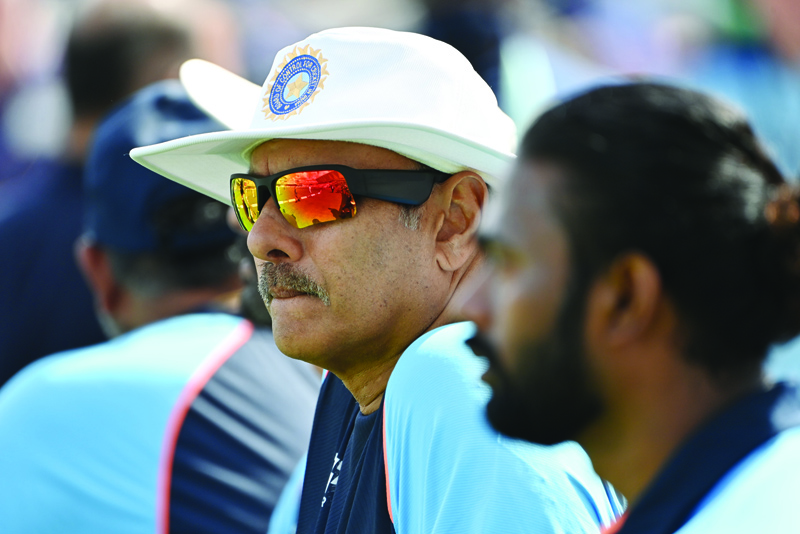 NOTTINGHAM: In this file photo taken on August 4, 2021 India's head coach Ravi Shastri looks on ahead of play on the first day of the first cricket Test match of the India Tour of England 2021 between England and India at the Trent Bridge cricket ground in Nottingham. - AFPn
