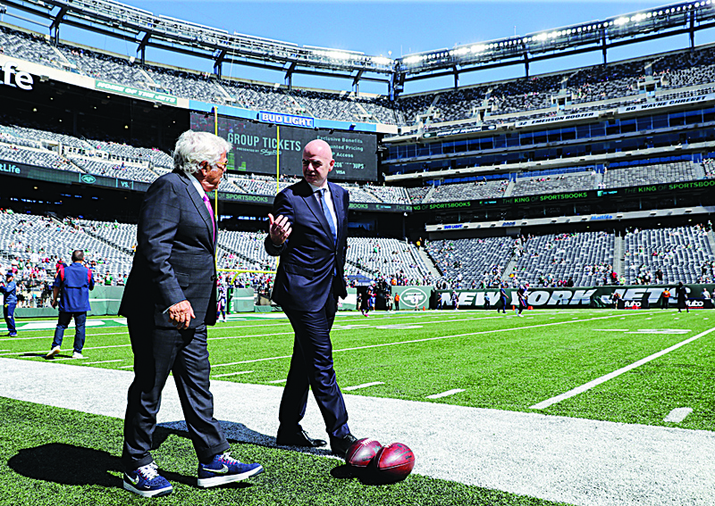 EAST RUTHERFORD: New England Patriots owner Robert Kraft (left) and FIFA President Gianni Infantino talk on the field prior to the game between the New England Patriots and the New York Jets at MetLife Stadium on Sunday in East Rutherford, New Jersey. - AFPn