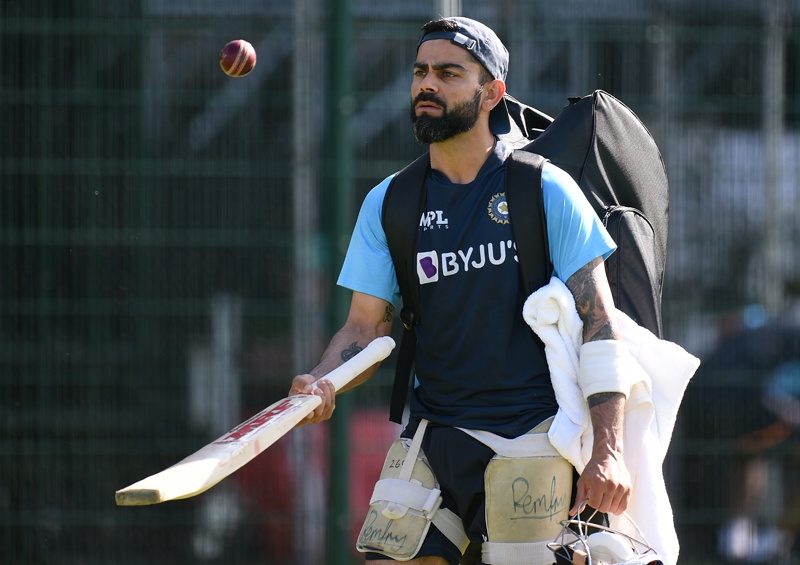 MANCHESTER: India's captain Virat Kohli bounces a ball on a cricket bat during a team practice session ahead of the fifth cricket Test match between England and India at Old Trafford in Manchester, north-west England on September 8, 2021. - AFPn
