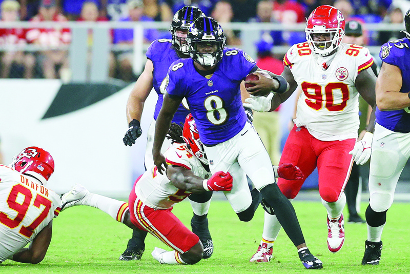 BALTIMORE: Lamar Jackson #8 of the Baltimore Ravens runs with the ball during the fourth quarter against the Kansas City Chiefs at M&T Bank Stadium on Sunday in Baltimore, Maryland. - AFPn