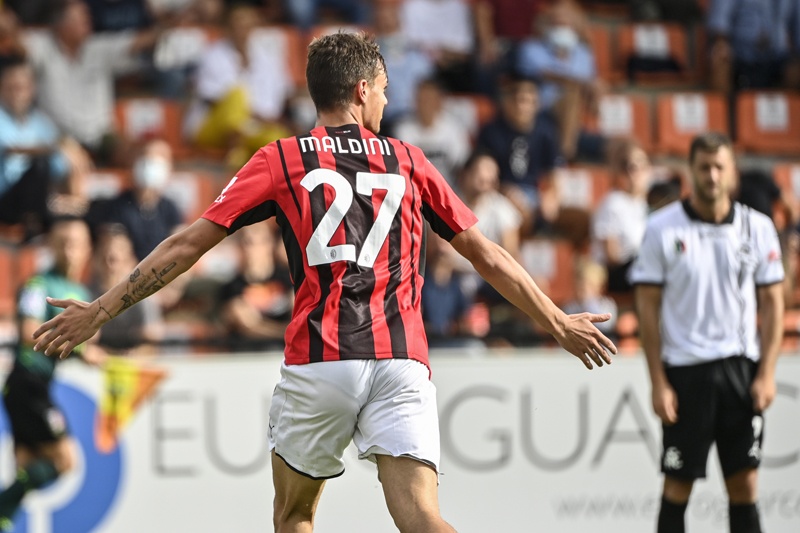 AC Milan's Italian forward Daniel Maldini celebrates after opening the scoring during the Italian Serie A football match between Spezia and AC Milan on September 25, 2021 at the Alberto-Picco stadium in La Spezia. (Photo by Alberto PIZZOLI / AFP)