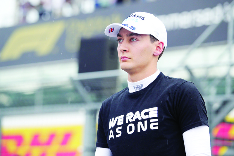 MOGYOROD: In this file photo taken on August 1, 2021, Williams' British driver George Russell looks on during a 'We Race As One' ceremony ahead of the Formula One Hungarian Grand Prix at the Hungaroring race track in Mogyorod near Budapest. - AFPnn