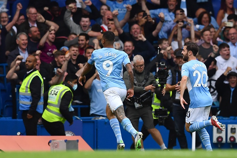 LONDON: Manchester City's Brazilian striker Gabriel Jesus (left) celebrates scoring his team's first goal during the English Premier League football match between Chelsea and Manchester City at Stamford Bridge in London yesterday.n