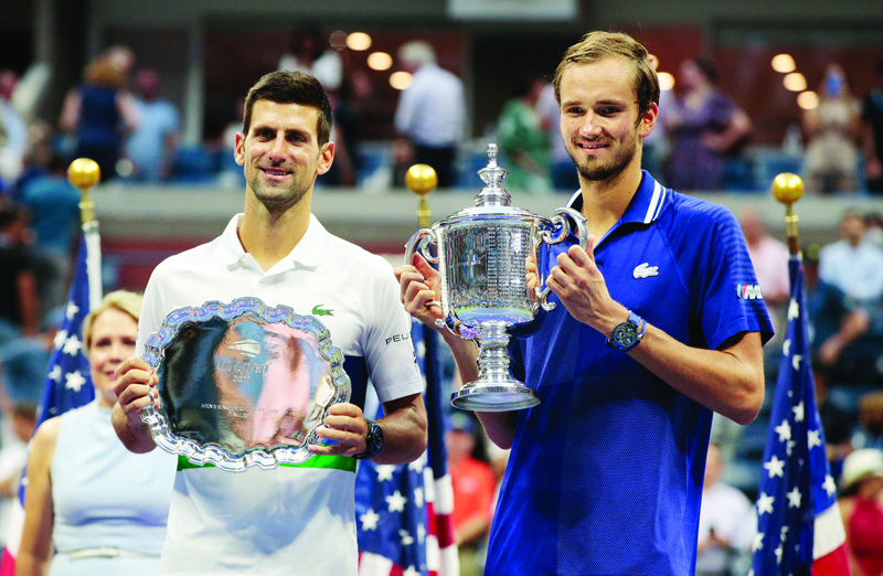 NEW YORK: Winner Russia's Daniil Medvedev (right) and Serbia's Novak Djokovic hold their trophies after the 2021 US Open Tennis tournament men's final match against at the USTA Billie Jean King National Tennis Center in New York, on Sunday. - AFPn