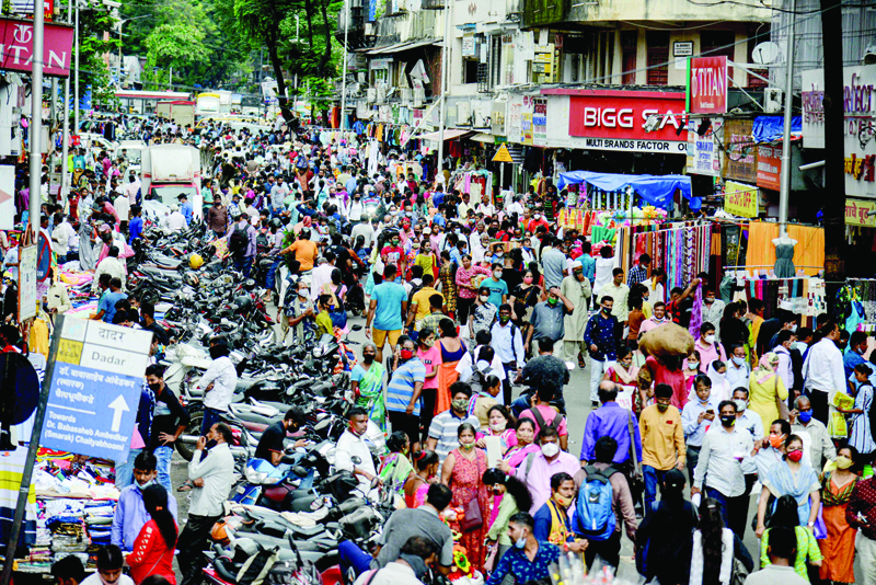 MUMBAI: People throng a market in Mumbai. - AFP n