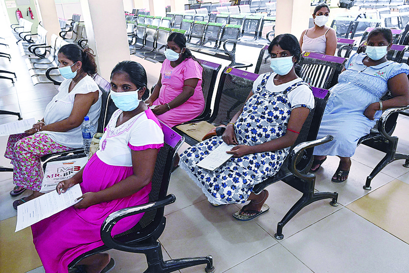COLOMBO: Pregnant women wait to get a dose of the Chinese-made Sinopharm COVId-19 vaccine in Colombo. Sri Lankan women were urged to delay getting pregnant after more than 40 expectant mothers died of COVID-19 in four months.- AFP n