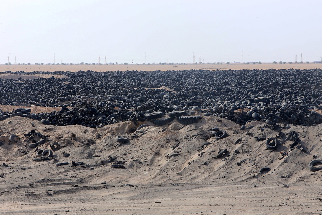 KUWAIT: These pictures show used tires that were transported from a landfill in the north of Kuwait to Al-Salmi border region near the country’s industrial area, where they will be cut or repurposed for local use or for export, on Wednesday. — Photos by Yasser Al-Zayyat