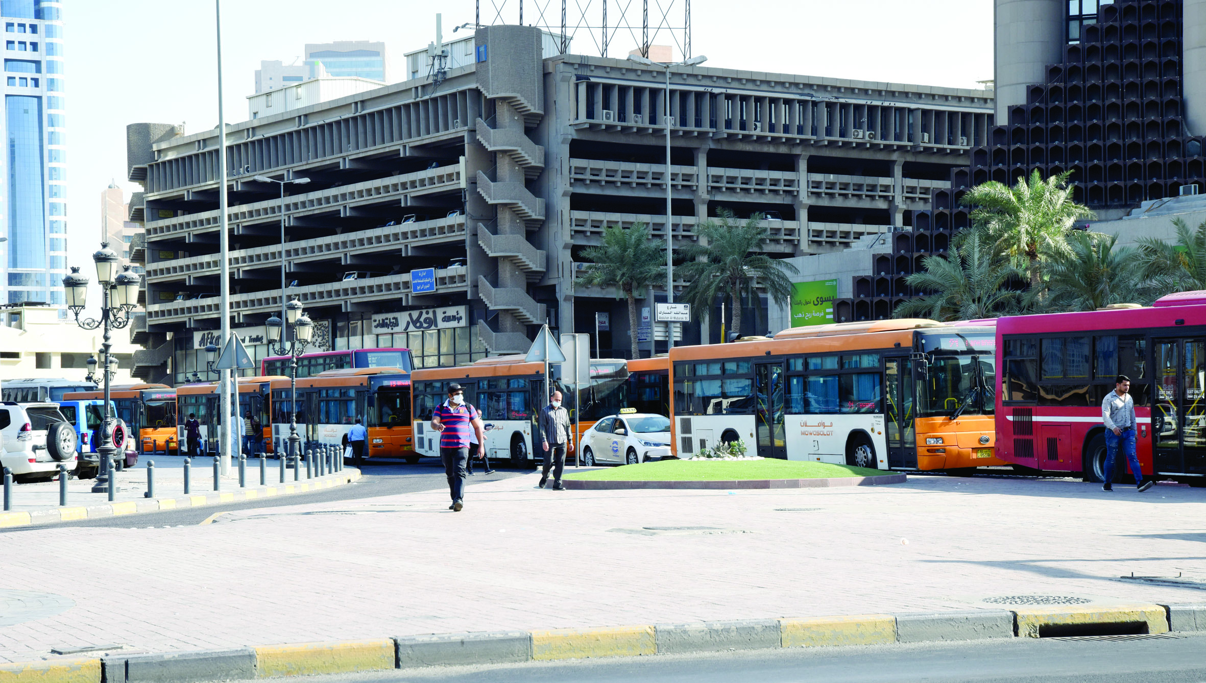 KUWAIT: This file photo shows a long line of public transportation buses at the busy Abdullah Al-Mubarak Street in Kuwait City. - Photo by Fouad Al-Shaikhn(To have your picture featured in the Kuwait Times' 'Photo of the Day' section, please send your horizontal, high resolution and unedited photos to local@kuwaittimes.com, along with the full name and Instagram account, in addition to a description showing the picture's location and date taken)