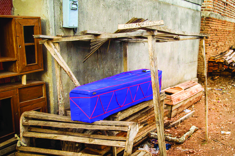 NAMUTUMBA: A coffin is on display to sell at a workshop owned by private teachers who work as coffin makers now at their workshop in Namutumba, Uganda. - AFP n