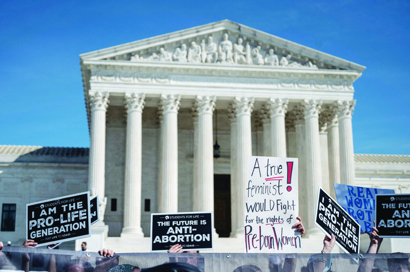 WASHINGTON: Pro-Life activists counter-protest the Women's March and Rally for Abortion Justice at the US Supreme Court in Washington, DC, on October 2, 2021. - AFP n