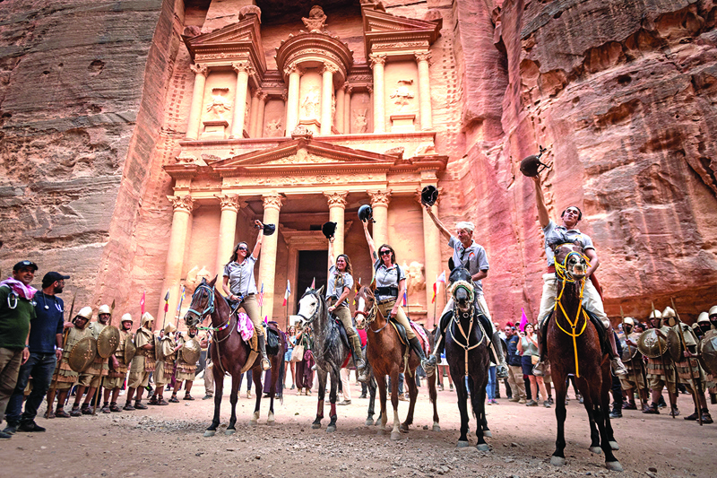 A rider team poses in the Petra touristic site during the fifth and last stage of the Gallops of Jordan in Petra, south Ammam.—AFP photosn