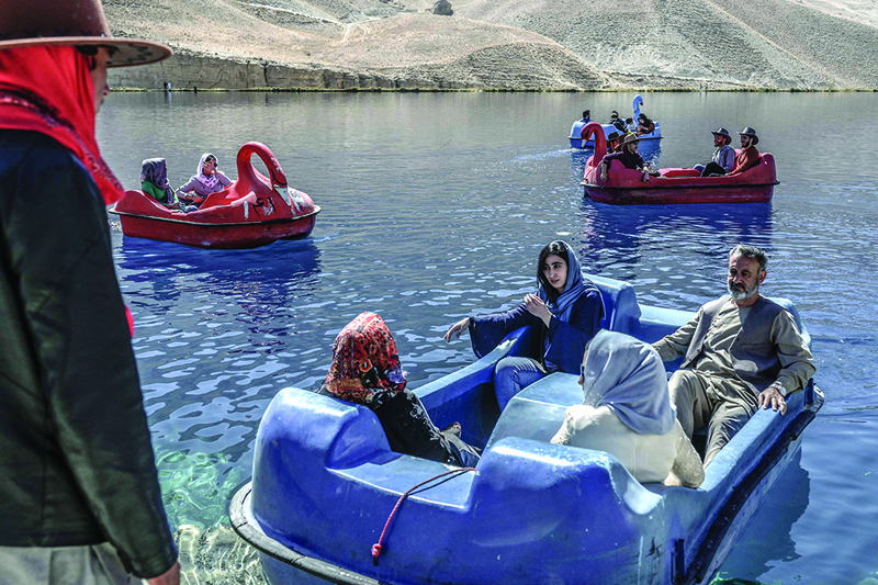 People sit on paddle boats for a ride at the Band e-Amir lake in the Bamiyan Province. The stunning azure waters of the Band-e Amir lakes are once again attracting Afghan tourists, who brave bumpy roads to experience the so-called Grand Canyon of Afghanistan. - AFP photosn