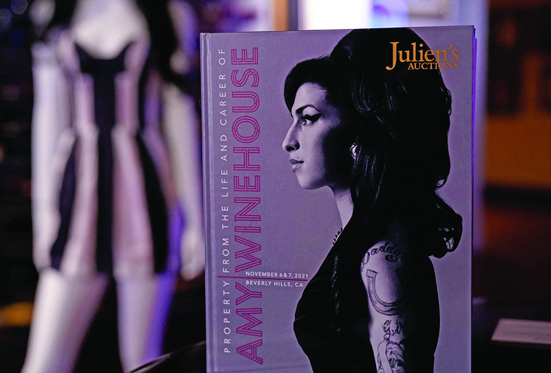 An auction catalog is displayed during the New York press and public exhibition of the “Property From The Life And Career Of Amy Winehouse” by Julien’s Auctions in New York.—AFP photosn