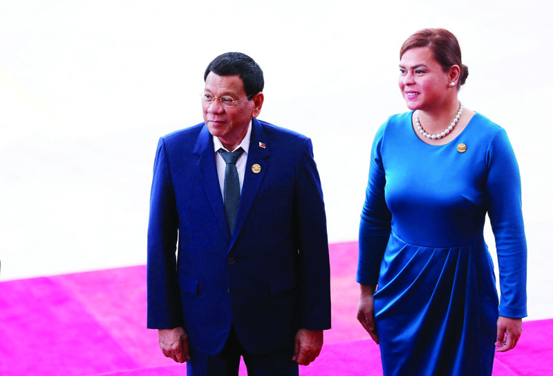 BOAO: In this file photo, Philippine President Rodrigo Duterte and his daughter Sara Duterte arrive for the opening of the Boao Forum for Asia (BFA) Annual Conference 2018 in Boao, southern China's Hainan province. Philippines 'First Daughter' Sara Duterte has been in lockstep with her father, following him into law and succeeding him as a city mayor. - AFP n