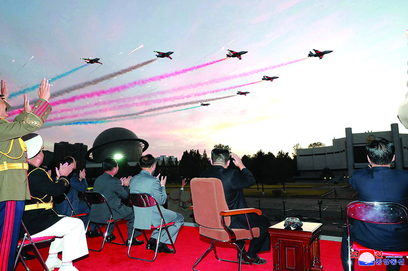 PYONGYANG: North Korean leader Kim Jong Un (2nd right) watches a demonstration flight during the opening ceremony of the defense development exhibition ‘Self-Defence-2021’ in Pyongyang. – AFP n