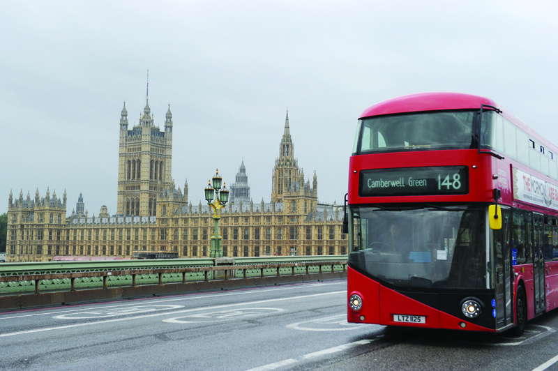 LONDON: In this file photo taken on October 16, 2021, a bus is driven on Westminster Bridge past the Houses of Parliament in central London.-AFPnn