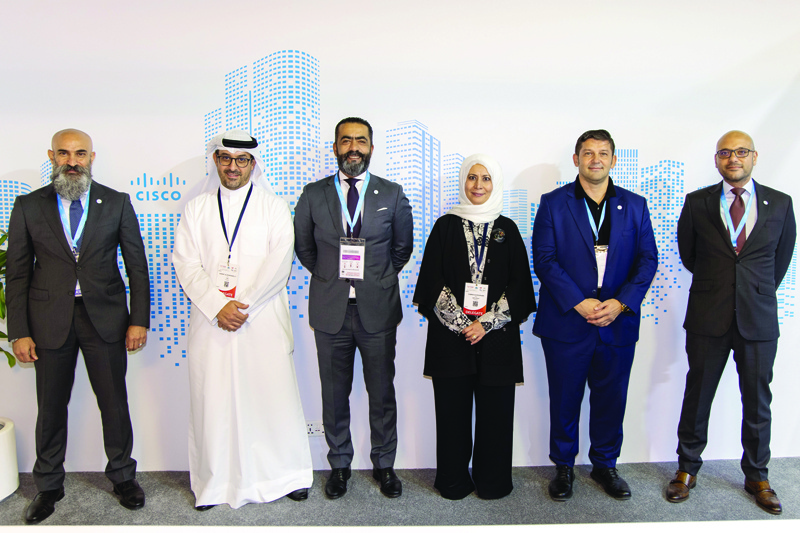 DUBAI: Eaman Al-Roudhan with Shukri Eid and Nawaf Al-Gharabally along with Cisco officials at GITEX.n