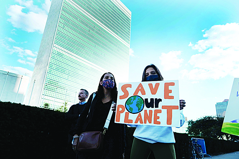 NEW YORK: A group of students take part in a protest in support of the climate and against fossil fuel and other contributors to global warming in front of the United Nations (UN) in Manhattan. - AFP n