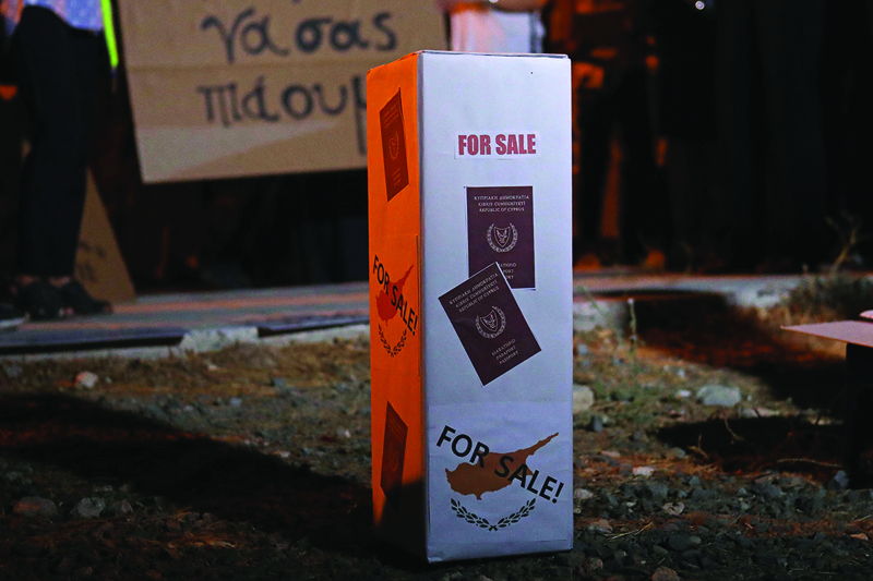 NICOSIA: A mock ballot box with Cyprus Passports reading 'For Sale' is seen during a demonstration against corruption outside the Filoxenia Conference Center, the current parliament location, in the Cypriot capital Nicosia. - AFP n