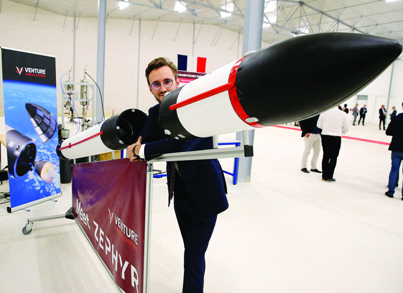 REIMS: Stanislas Maximin, the 22-year-old CEO of Venture Orbital Systems, a start-up with the ambition to produce micro-satellite lacers, poses with a 1/4 scale model of the ZEPHYR launcher.- AFP n