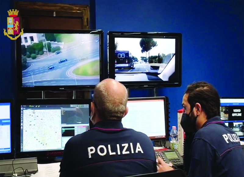 ROME: This image grabbed from a video handout shows police officers monitoring on screens the arrival of US President Joe Biden's motorcade arriving yesterday at the convention center 'La Nuvola' in the EUR district of Rome for the second day of the G20 world leaders summit. - AFP  n