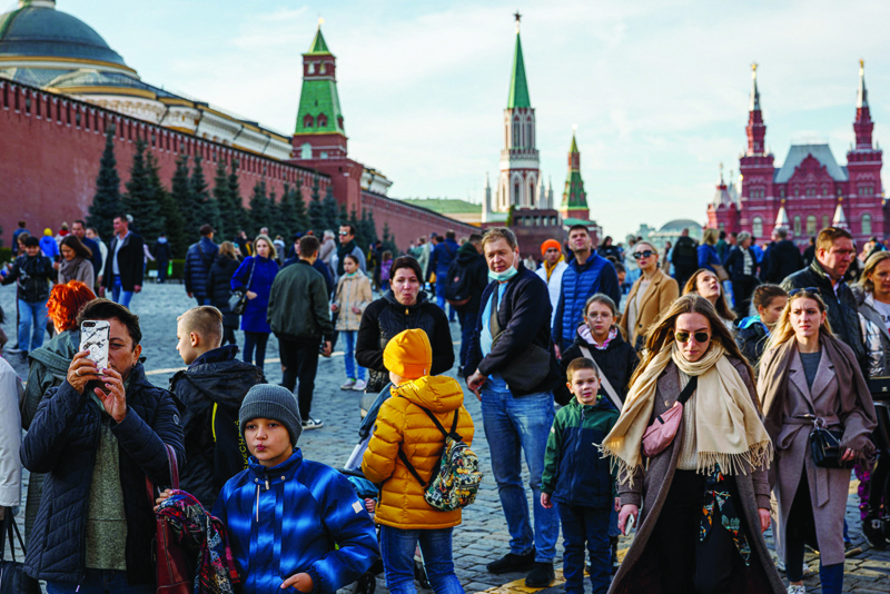 MOSCOW: People walk through the Red Square in a sunny autumn day in Moscow. - AFP n