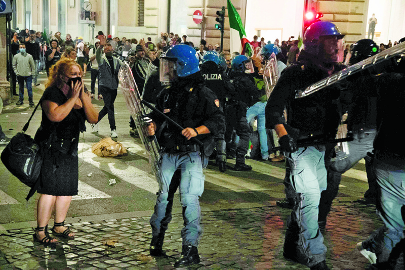 ROME: Riot police surround protesters during clashes following a protest against the mandatory sanitary pass called 'green pass' in the aim to limit the spread of the COVID-19, in central Rome. -  AFPn