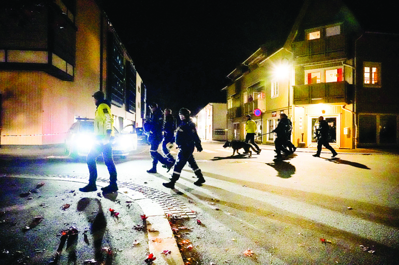 KONGSBERG: Police officers cordon off the scene where they are investigating in Kongsberg, Norway after a man armed with bow killed several people before arrested by police on October 13, 2021. - AFP n